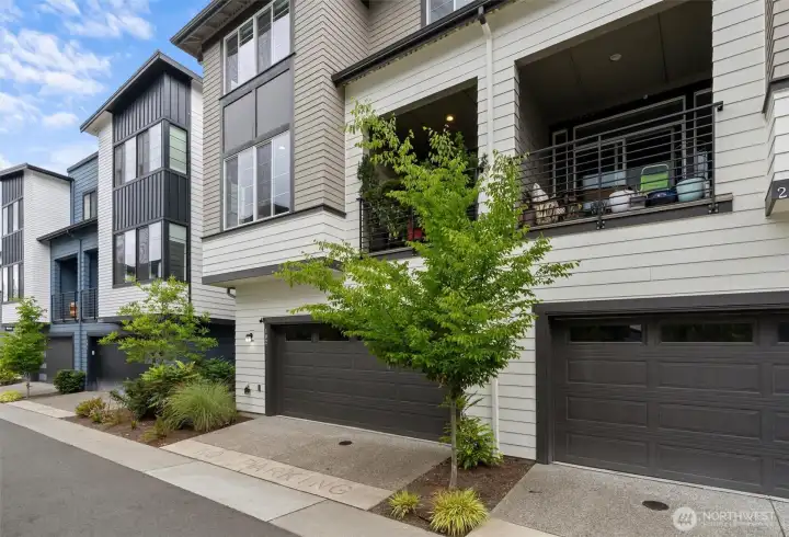 The garage is discreetly positioned behind the unit, providing seamless access and added convenience.