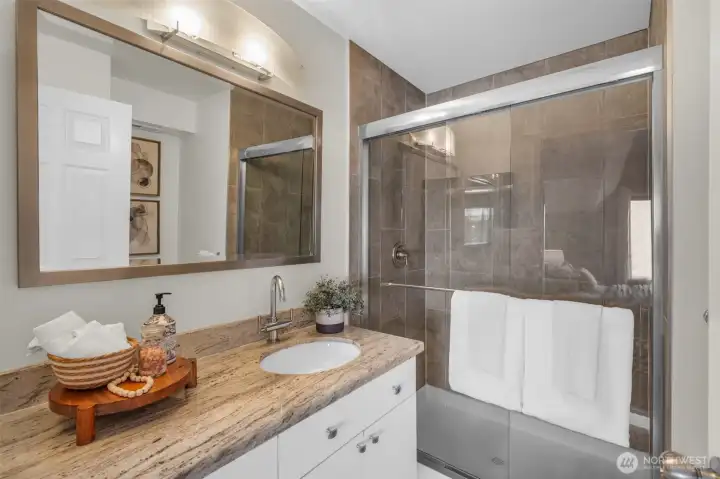 Beautiful & contemporary Primary bathroom with quartz counters.