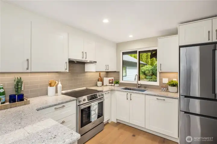 Beautifully updated kitchen with top of the line Bosch stainless steel appliances.