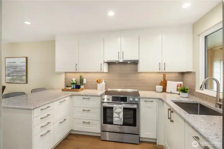 Special under cabinet lighting and sleek hood vent.