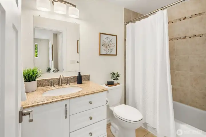 The second ensuite includes a bathtub for a relaxing soak