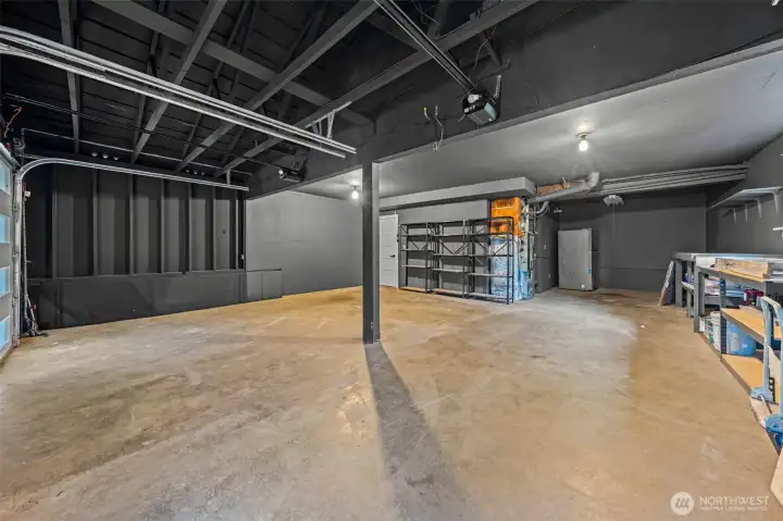 Look at this beautiful garage!!!!! Nice new insulated garage doors~There is room for 3 cars.  One tandem.