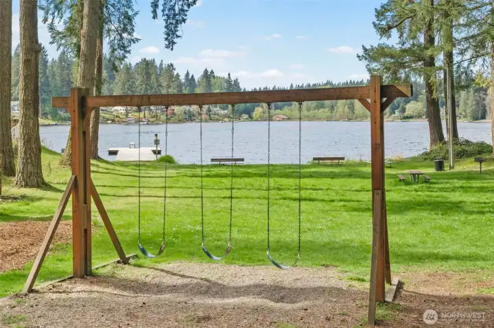 Swings and other play toys to enjoy at the Beach club park~