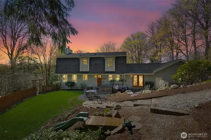 Home sits on a shy acre and borders Cougar Mountain Regional Wildland Park.