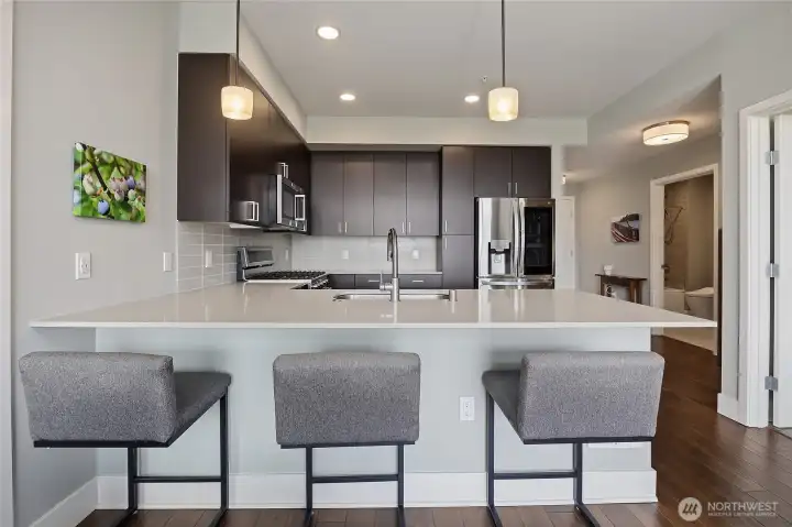 Open concept kitchen with convenient bar seating Open concept kitchen with convenient bar seating