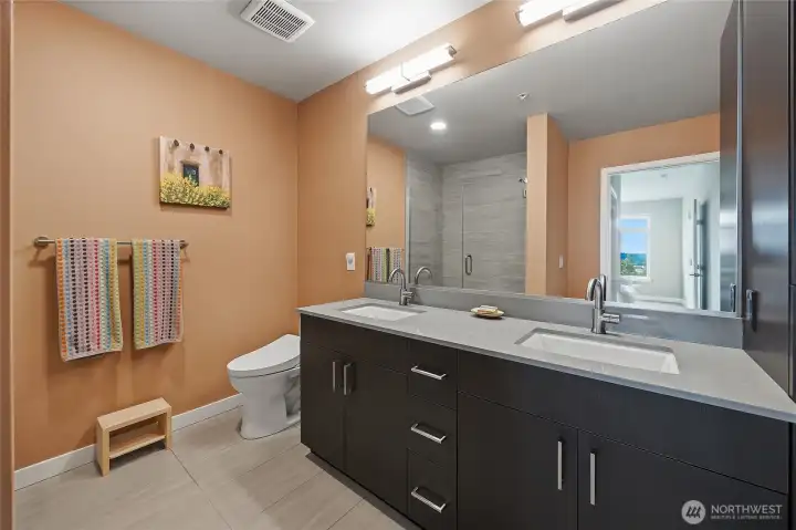 Luxurious private primary bathroom with tons of storage. Luxurious private primary bathroom with tons of storage.