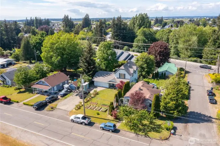 Great location in heart of town, notice all of those garden beds & blueberry bushes!