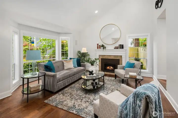 As you enter the home, direclty to your left is the living room with vaulted ceiling, dimmable can lights, gas fireplace and large windows for bountiful natural light.