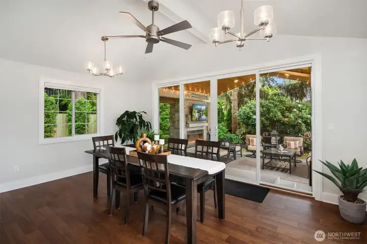 This dining room looks out at the covered patio with 16' slider door for easy indoor/oudoor entertaining.  This room is large enough to expand the table with 2 additional leaves and accomodate as many as 16 people.