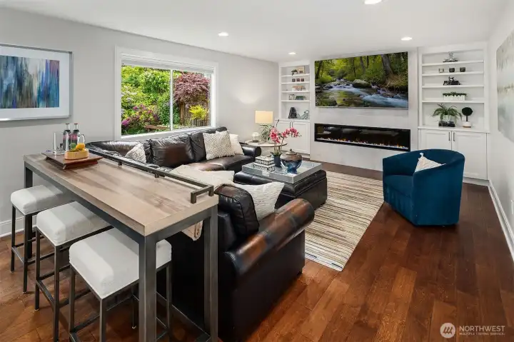 A closer view of the TV room with Electric Fireplace with Color Change technology as well as heat adjustment.