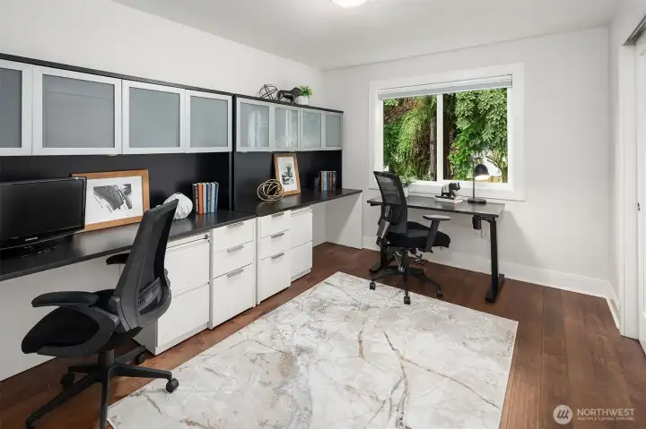 Bedroom #4 currently set up as an office; has Hardwood floors, a Wood Wrapped Window, a ceiling light and top down/bottom up black out shade.  You will have plenty of room for all your clothes with this double door closet.