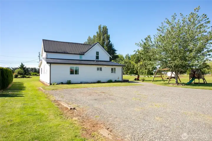 Back of house with parking area Back of house with parking area