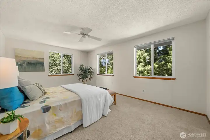 Spacious primary suite provides a private retreat.