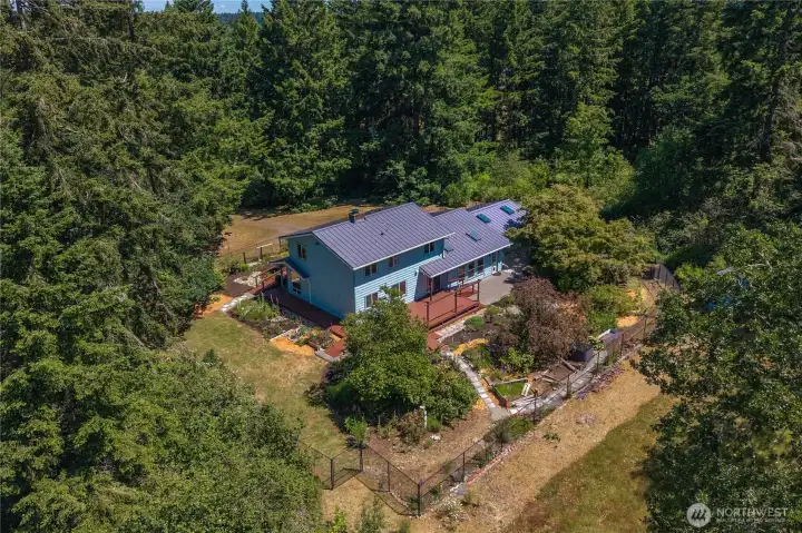 A rare combination of acreage, privacy, and convenience.