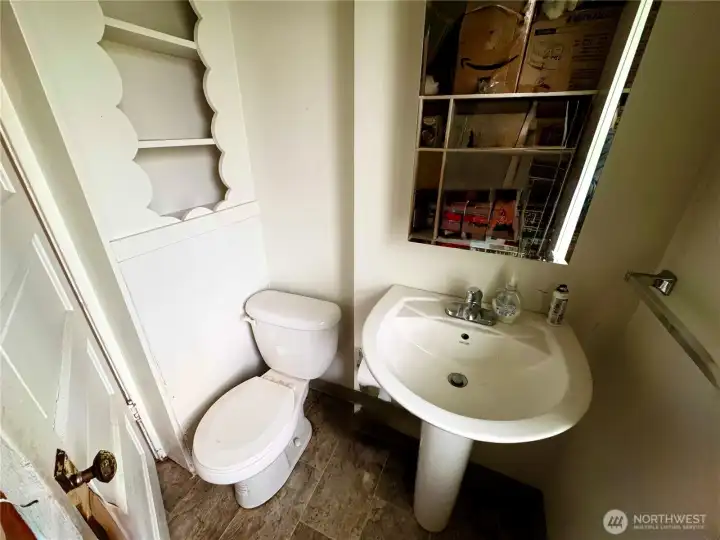 Powder room with storage shelves