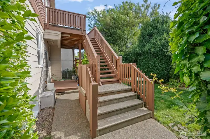 Stairs access to Unit 4709 upper unit through gate on north side of property.