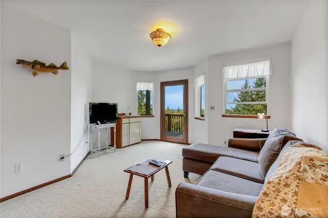 Family room at top off stairs, walk out to upper deck, spectacular valley views. On a clear day, see Seattle skyline