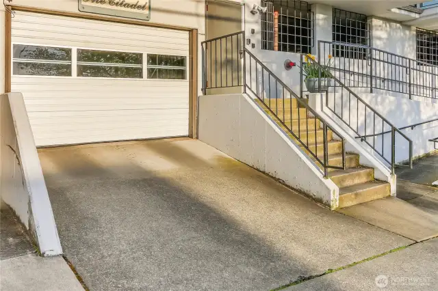 garage entry and additional steps into the building on the right