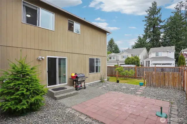 Backyard is ready for BBQ, summer fun, pets, and play.