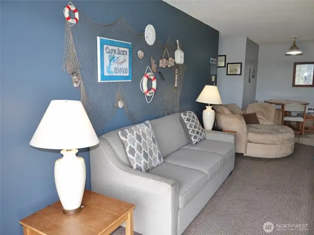 Hide-a-bed couch and beachy decorations.