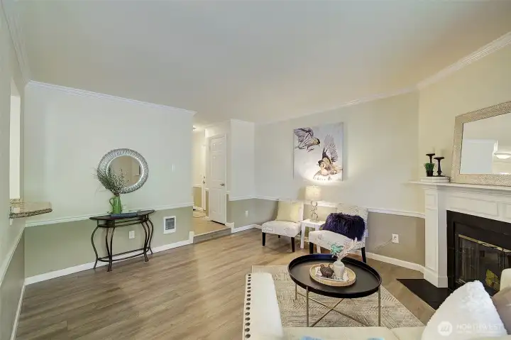 Living room features cozy wood burning fireplace for the cooler days.