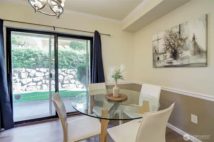 Slider leads out to private patio and green space.