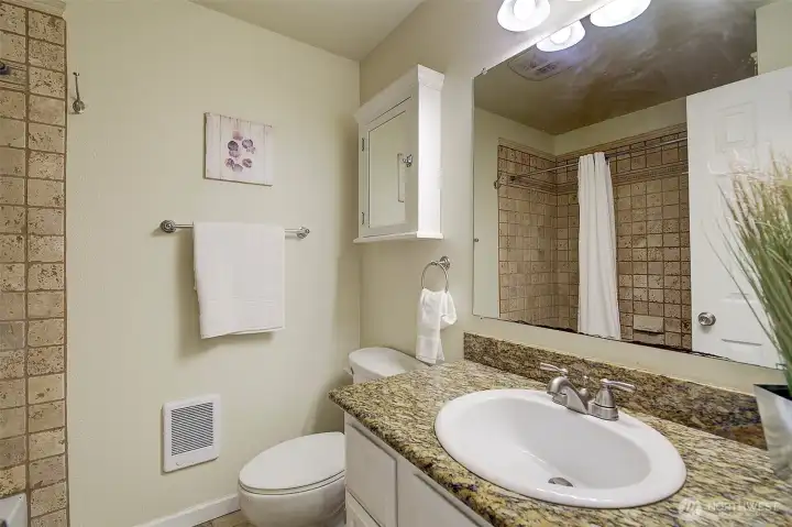 Main bath in hallway.