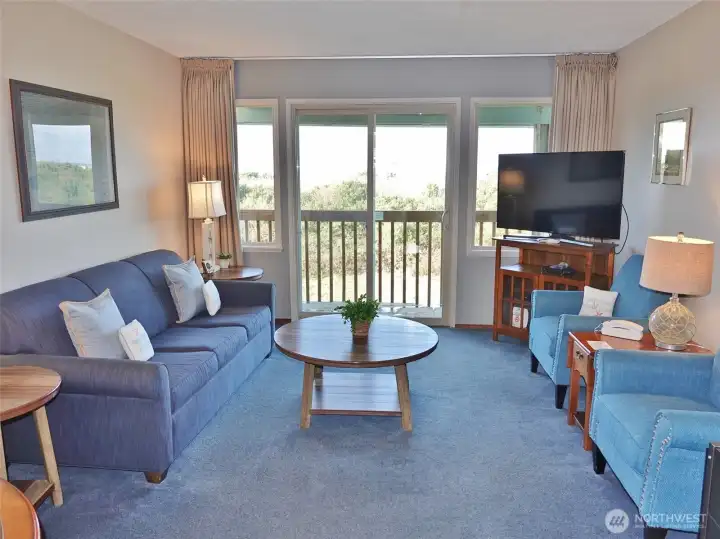 Comfortable Living Room w/ slider to the Rear Deck.