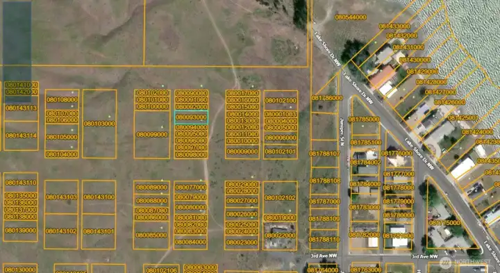 The single lots directly in front of and to the right of Parcel 080093000 are currently designated non-buildable, helping preserve water views unless parcels are combined under common ownership.