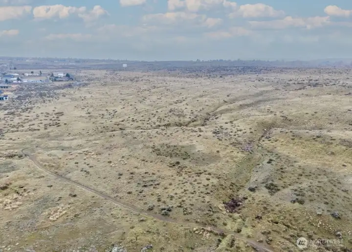 Aerial drone shot of the dirt road below the property.