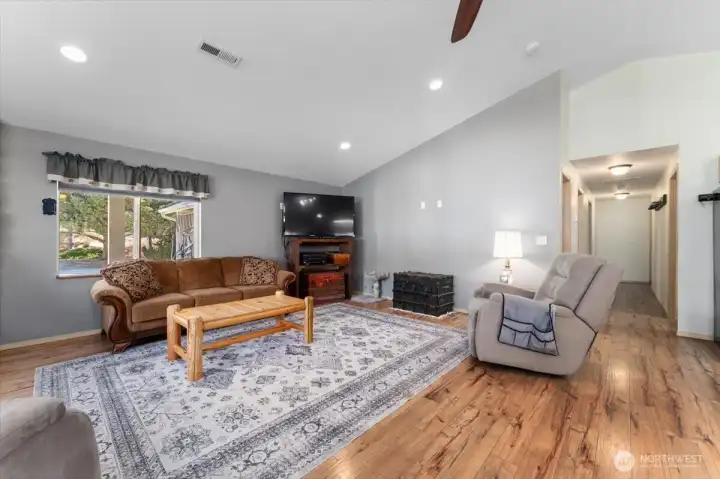Open living room with beautiful flooring.