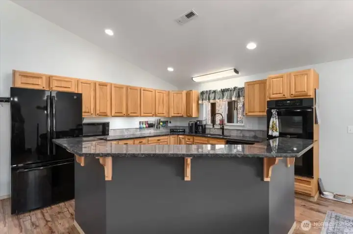 Kitchen with granite countertops and appliances are included with sale.