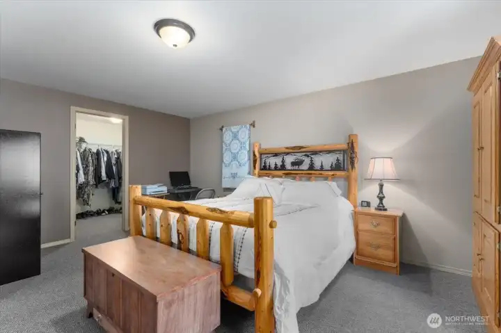 Primary bedroom with walk-in closet.
