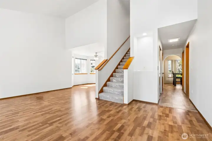 Large living room with vaulted ceilings. New carpets on the stairway and all the 4 upstairs bedrooms.
