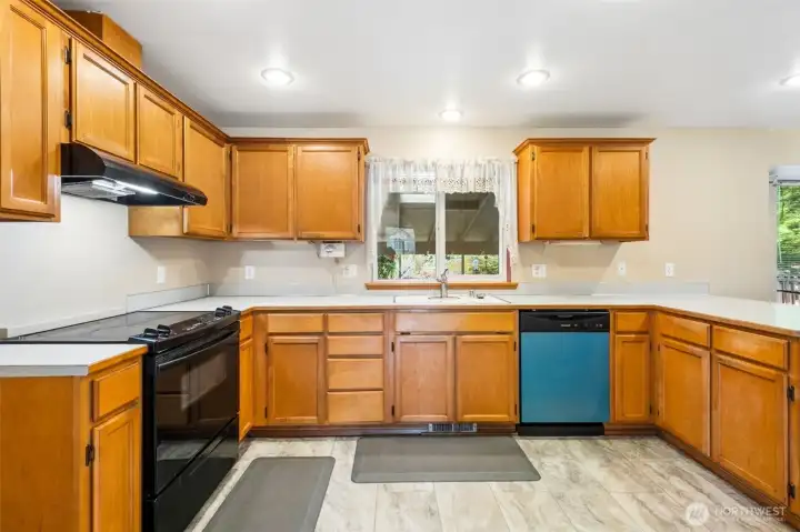 Large kitchen with new dishwasher.