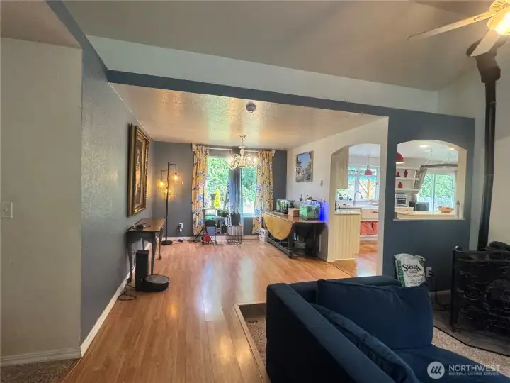 The dining room is directly next to the kitchen. This view, from the living room, shows the open concept living of this fine home.
