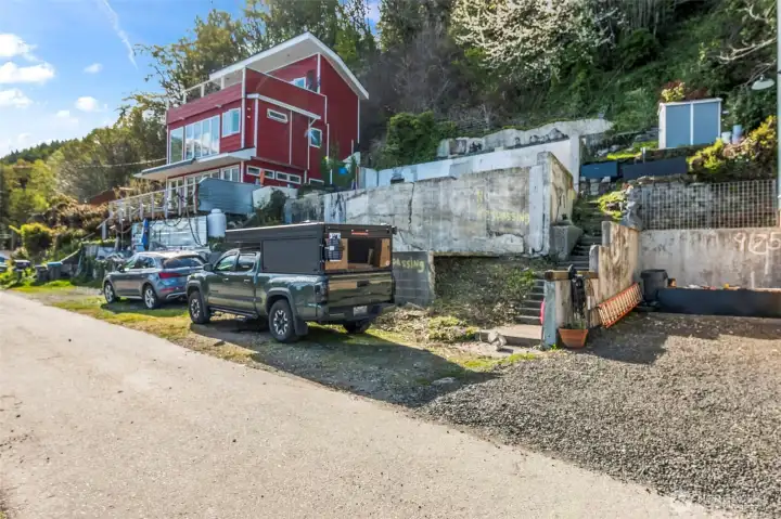 There is room for parking in front of existing foundation (future home) and a parking easement on the side as well.