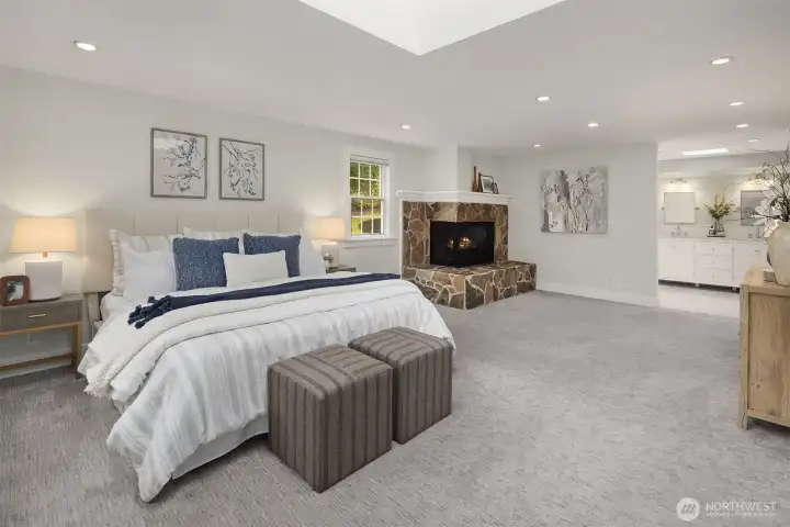 Primary suite continued — generous proportions, skylights, and a seamless flow to the sitting area and ensuite bath