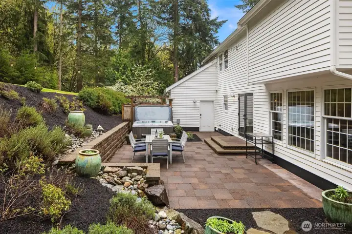 The kind of summer afternoon that starts inside over lunch and ends out here long after the sun goes down — private, landscaped, and completely your own