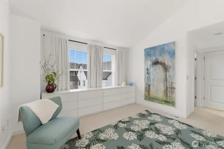 Primary bedroom with loads of additional space and natural light.
