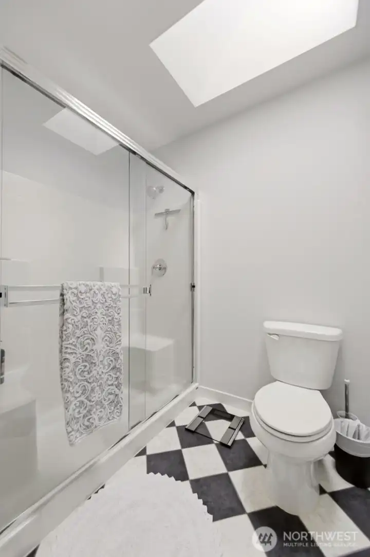 Large shower with seating.