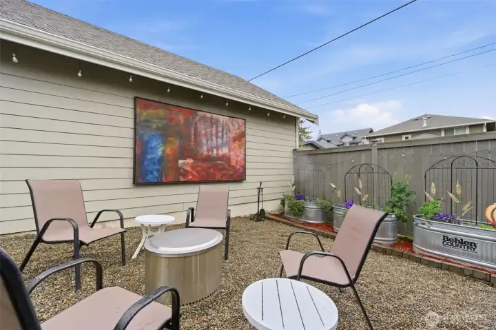 Additional space next to the garage to relax with a firepit.