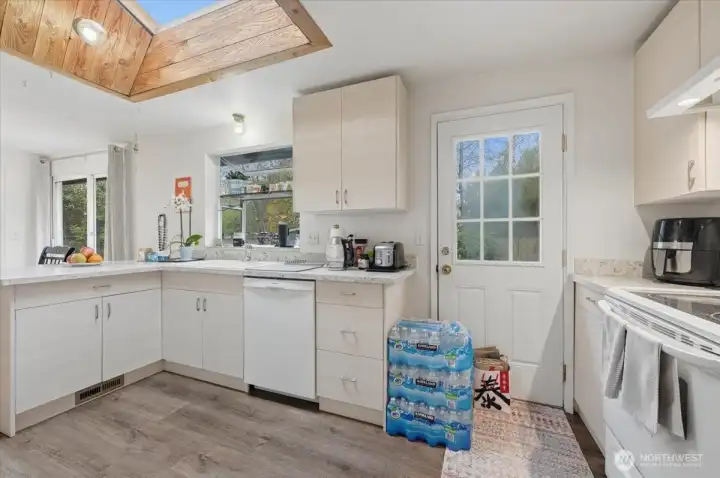 Bright, open kitchen with convenient access to the outdoors