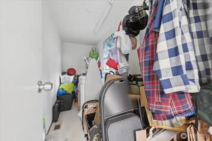 Practical laundry/utility room with extensive storage space