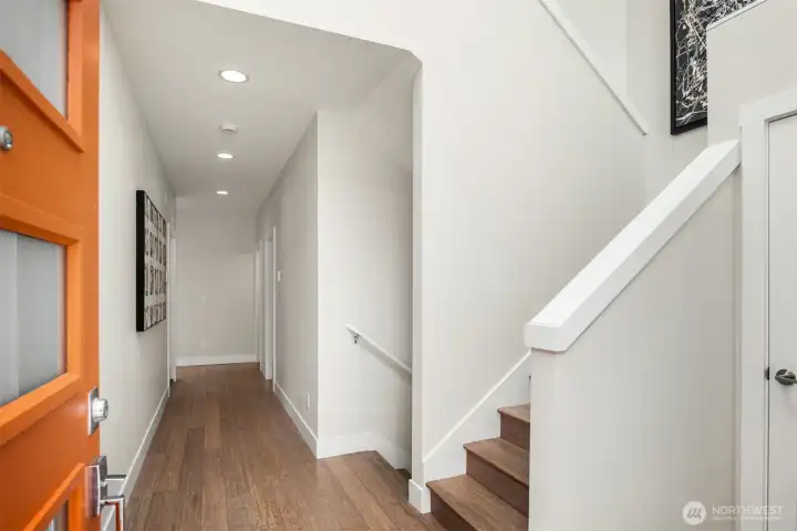A true great room, this main living area features floor-to-ceiling windows and an abundance of natural light.