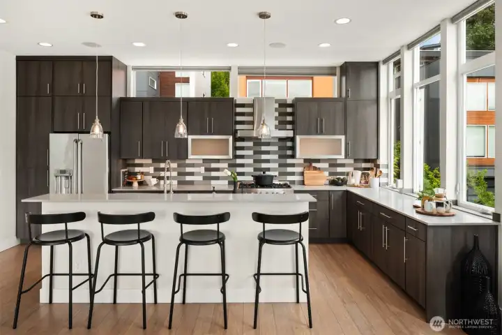 The island features a high breakfast bar that easily seats 4.