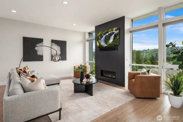 Looking back across the living room, there is a large wall for art and multiple furniture arrangements.