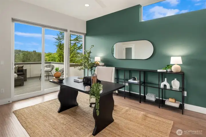 This massive main floor den / office is larger than most people's family rooms and features deck access as well as a closet and 2 glass french doors (stored downstairs for showings).