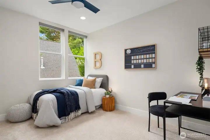 Just around corner from the primary is this second oversized bedroom also with high ceilings, a big walk-in closet and new carpet & paint.