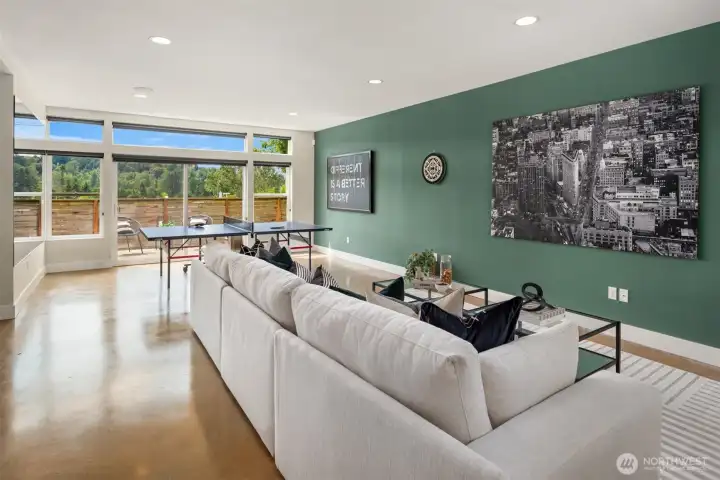 The lower leve is simply stunning with its gleaming polished concrete floors and enormous rec room plus 3 storage rooms.